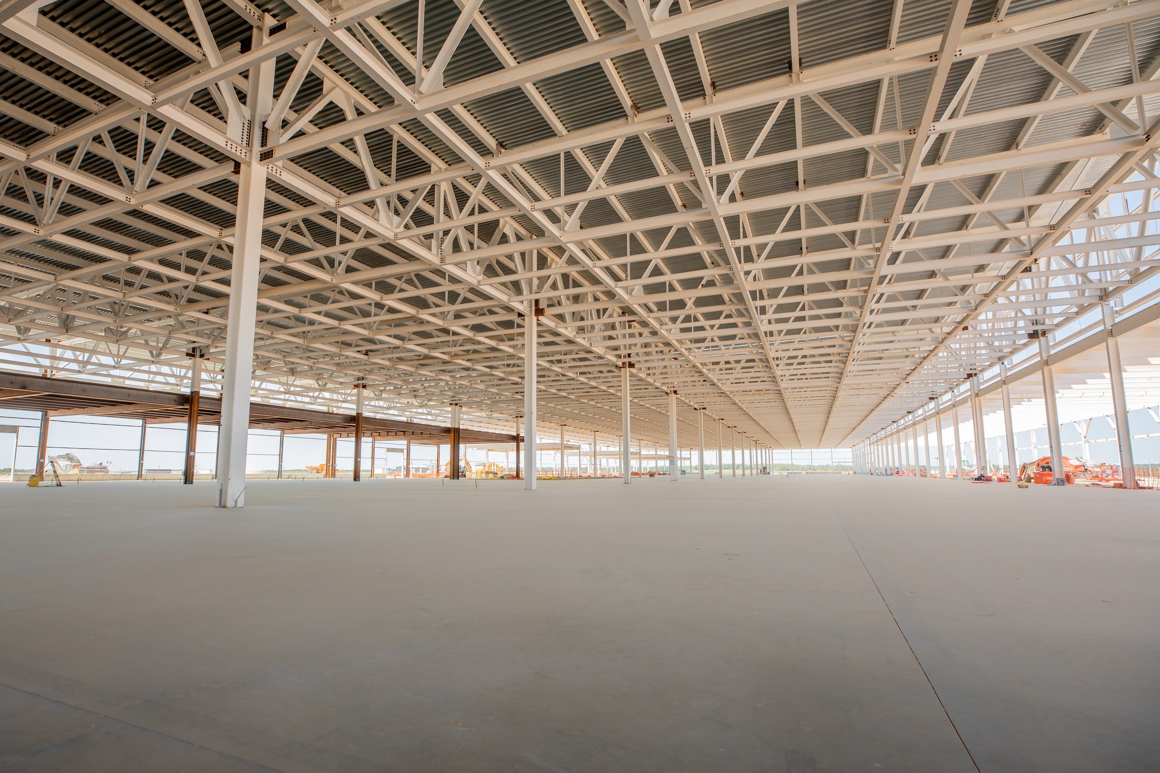 A large concrete slab with a steel structure atop from an angle