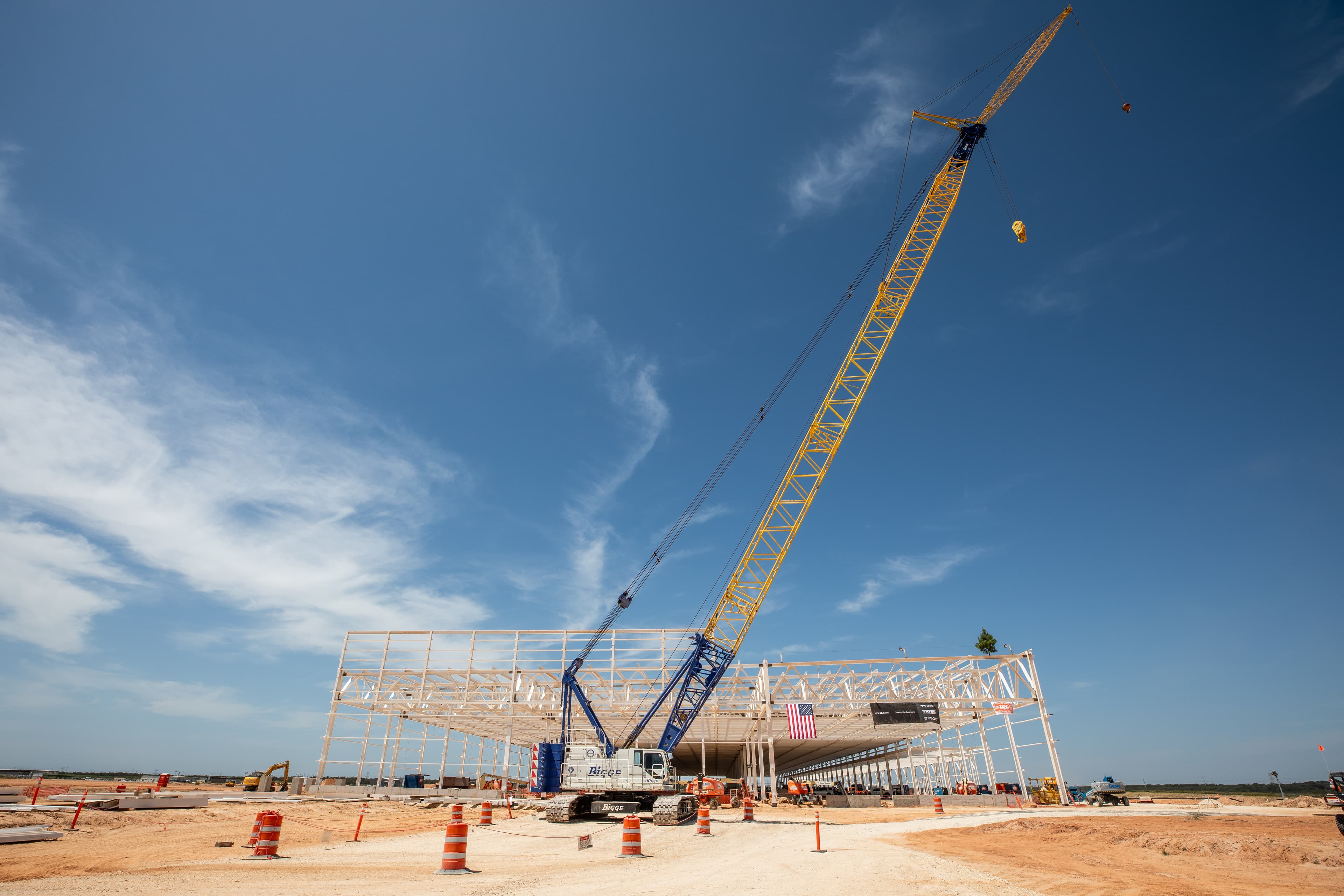 Side view of the G2 solar fab facility with a crane in the foreground
