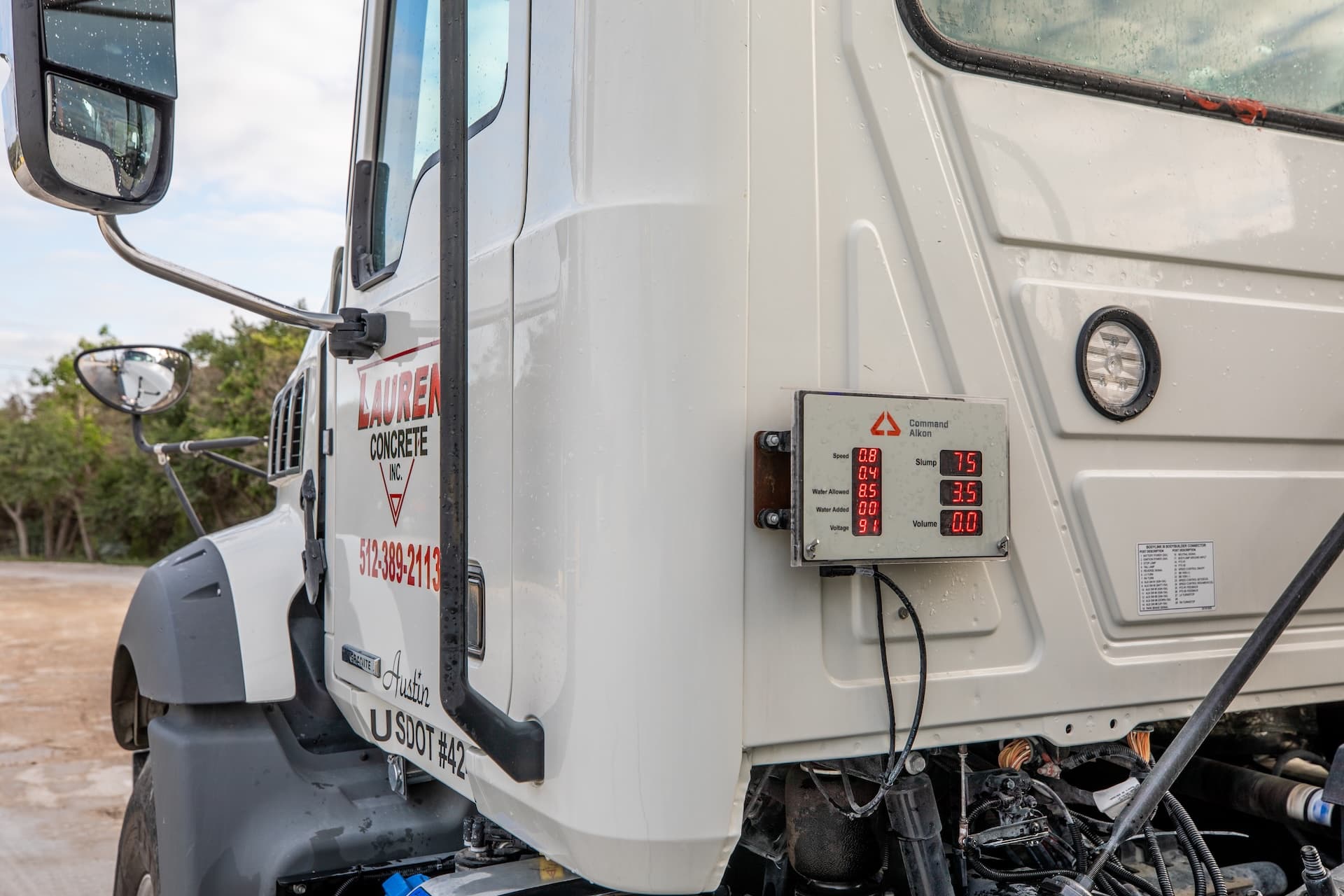 Command Assurance screen mounted on the back of the cab of the truck with data displayed.